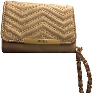 Guess wrist clutch. NWOT. Has multiple pockets including phone pocket